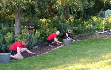 Volunteers helping in the garden